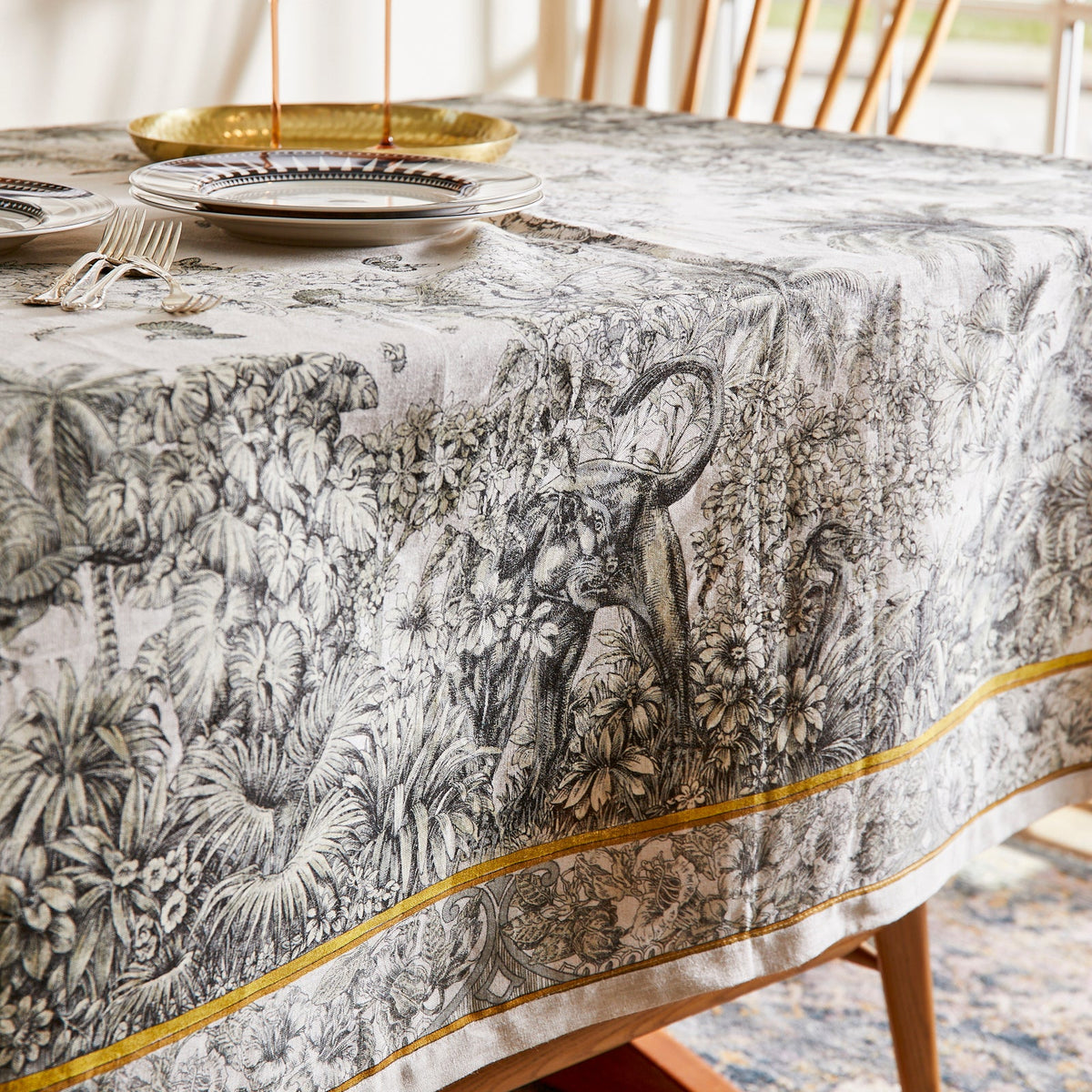 A black and white Morocco Linen Tablecloth with a floral pattern made of linen, by TTT.