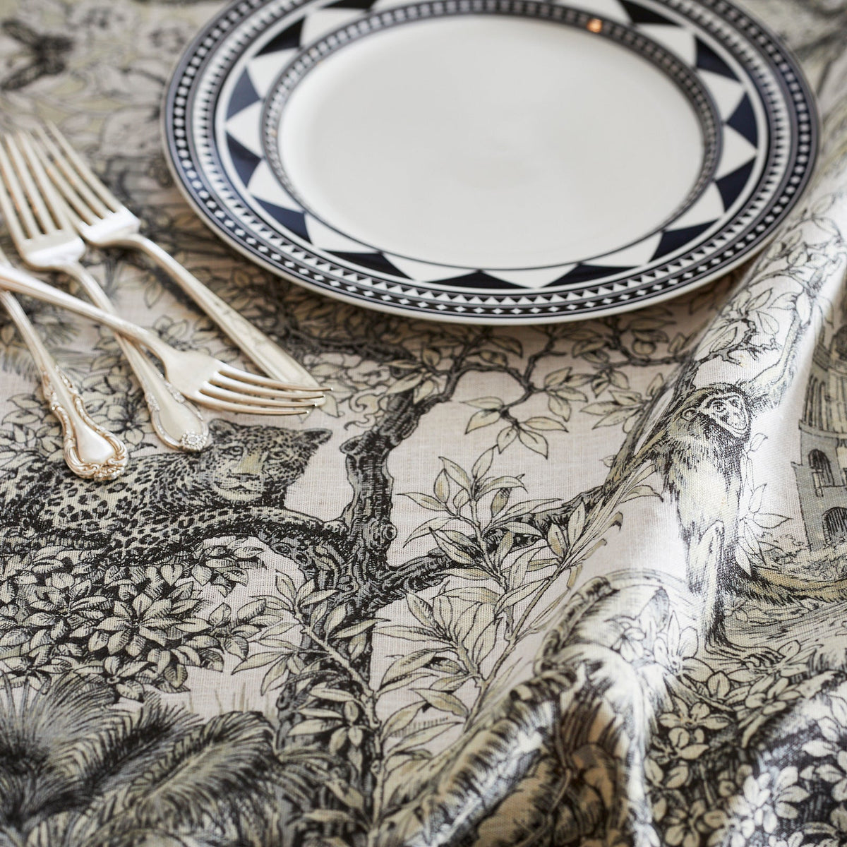 A Morocco Linen Tablecloth by TTT with a plate and fork on it.