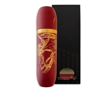 The Caskata x High Camp Red Lobster Parkside Flask by Caskata features a tall, cylindrical red design with gold decorative patterns and a gold band near the top, reminiscent of an elegant wine flask, displayed against its luxury gift box.