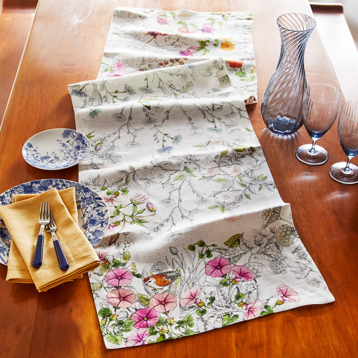 Nasturtium Print Table Runner in black and white with colored florals, birds and butterflies on Italian linen from Caskata