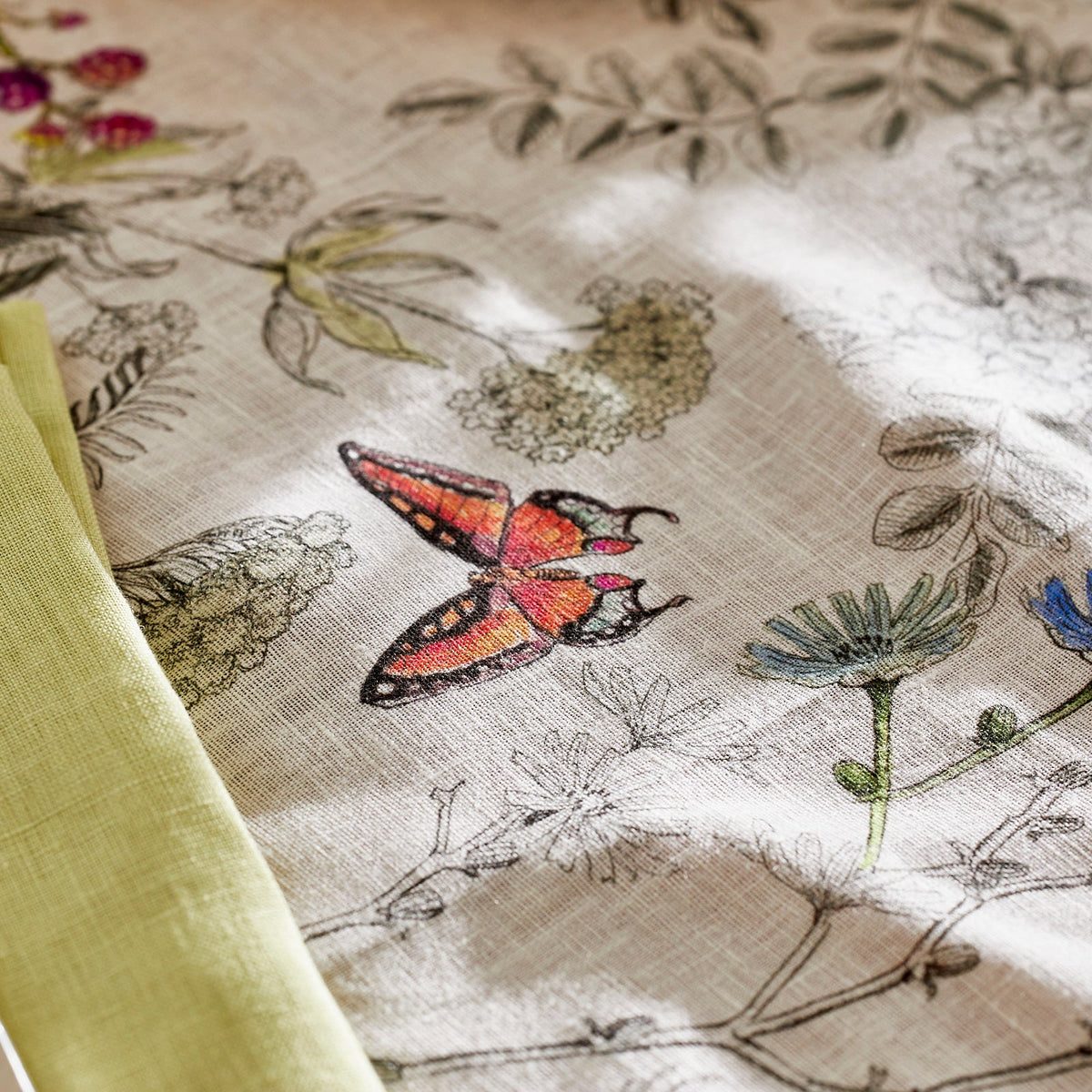Closeup of Butterfly Detail from Nasturtiums Table Runner In Italian Linen from Caskata
