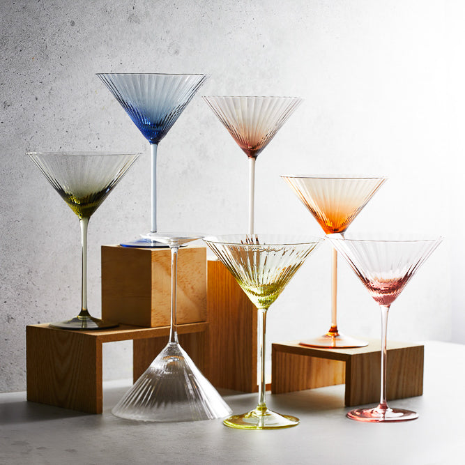 A collection of various colors of the Quin mouth-blown crystal martini glasses from Caskata.