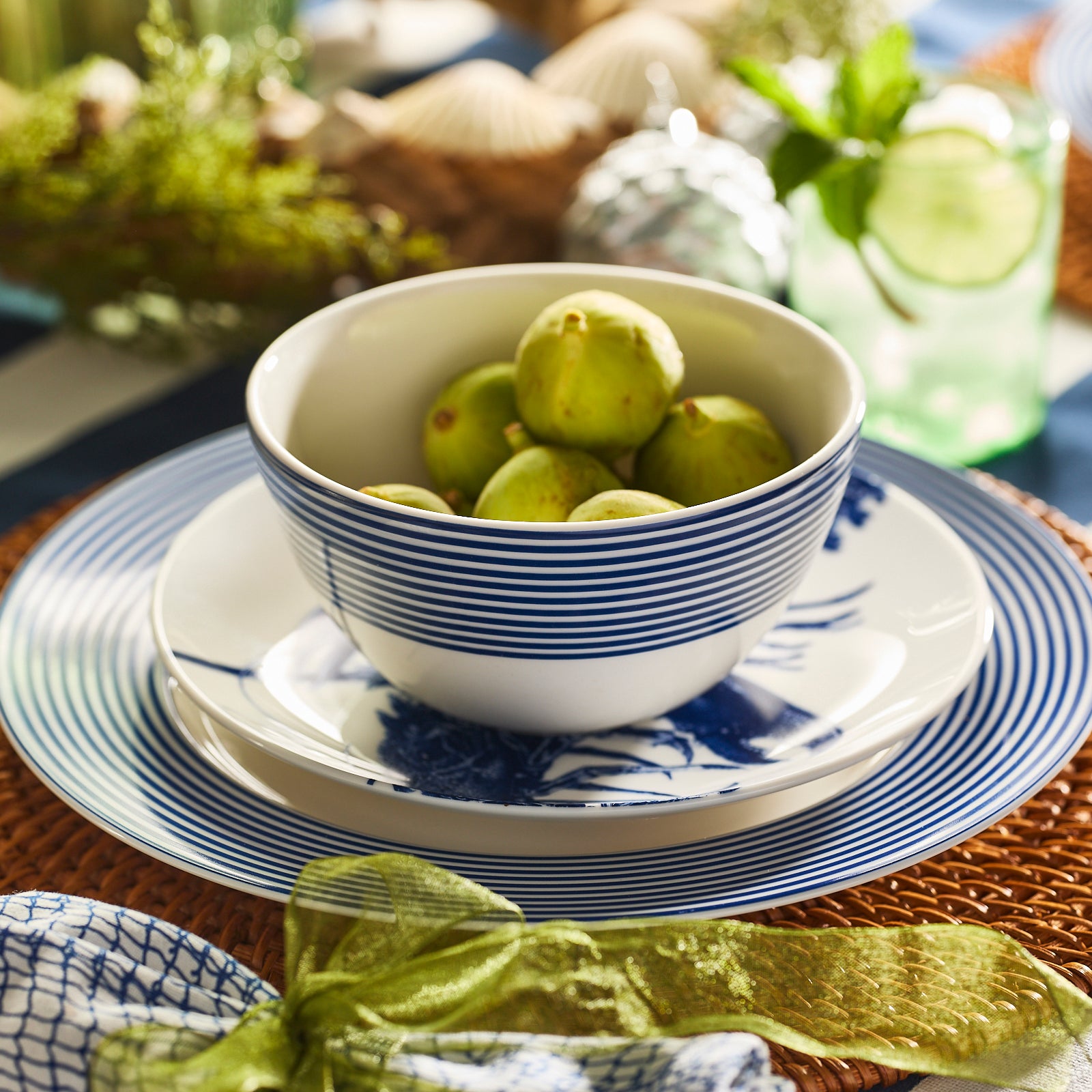 The Newport Stripe Cereal Bowl by Caskata Artisanal Home features premium white porcelain with multiple blue stripes near the rim, set against a classic white background.