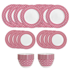 The Caskata Newport Crimson Garden Gate Table for 8 is a 24-piece porcelain set with ten plates, eight salad plates, and two bowls, each featuring a white center and a red geometric patterned border.