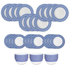 The Caskata Newport Garden Gate Table for 12 set includes 15 blue and white patterned plates arranged in rows, with three matching striped bowls displayed beneath them.