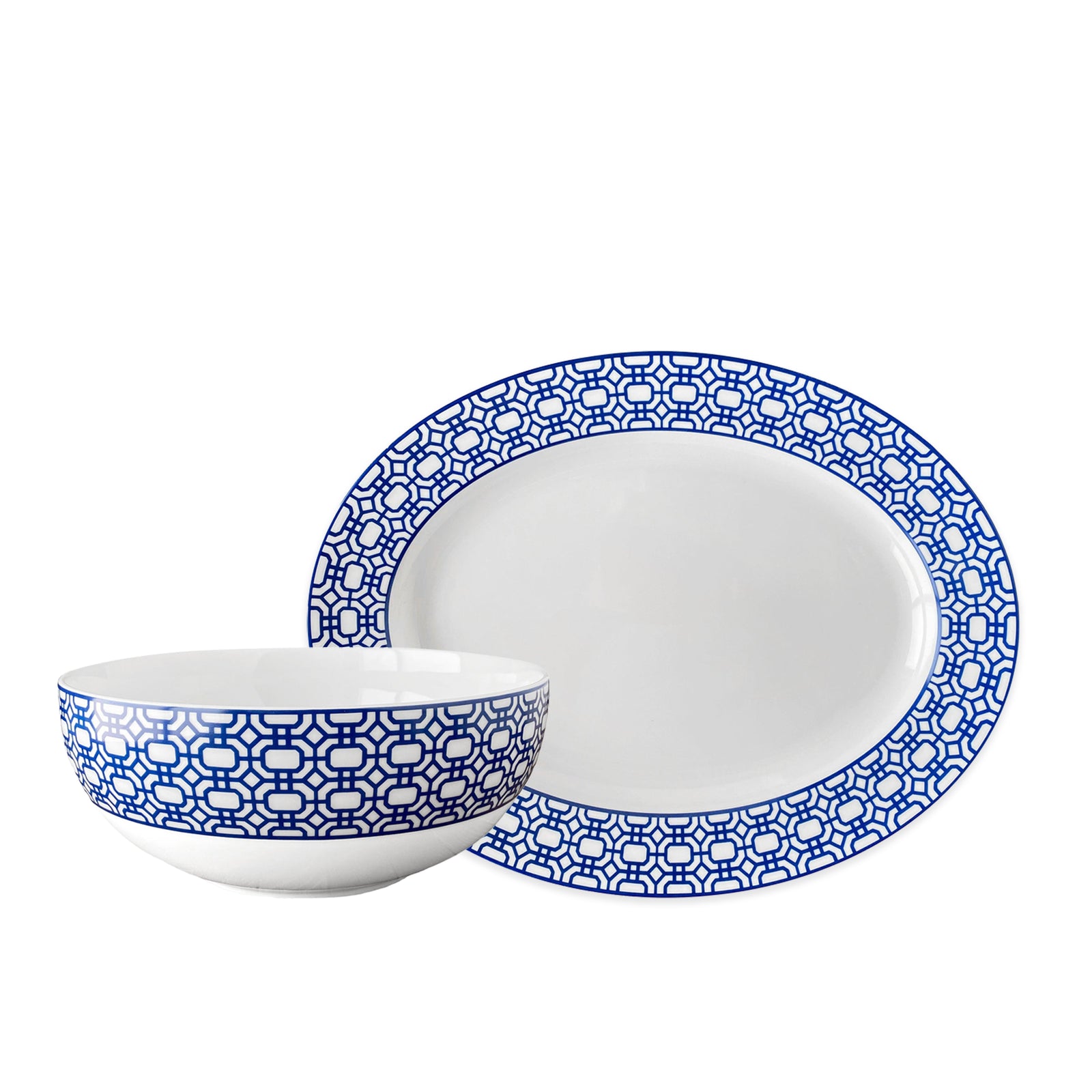 The Newport Serving Set by Caskata includes a white porcelain bowl and plate with blue geometric edge detailing, ideal for modern dinnerware collections.