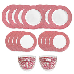The Newport Crimson Stripe Table for 8 by Caskata features red and white porcelain plates with concentric circles and two matching cups, all neatly arranged on a white background.