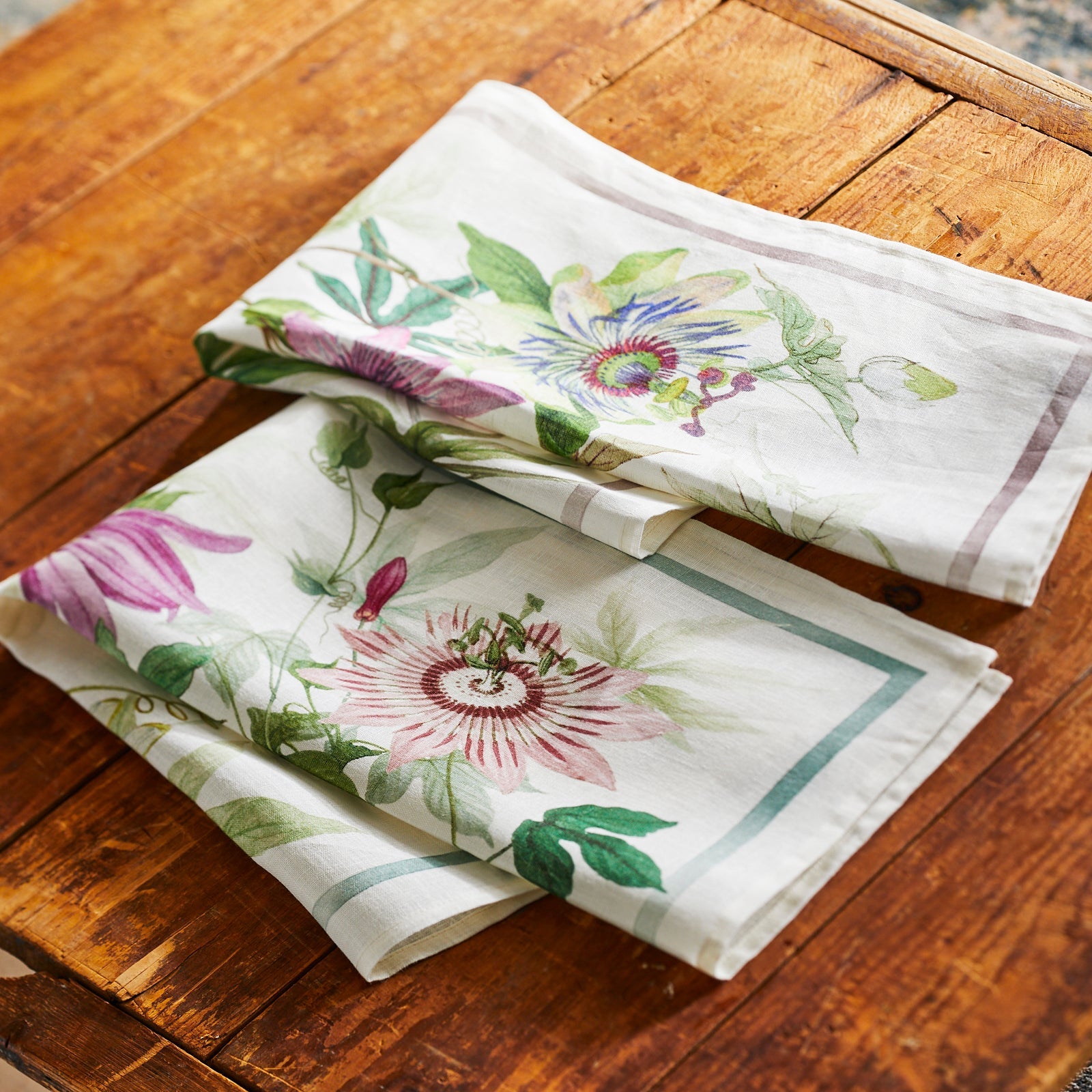 Passionflowers depicted in vivid watercolors on this set of 2 kitchen towels, made of 100% Italian linen, sold by Caskata