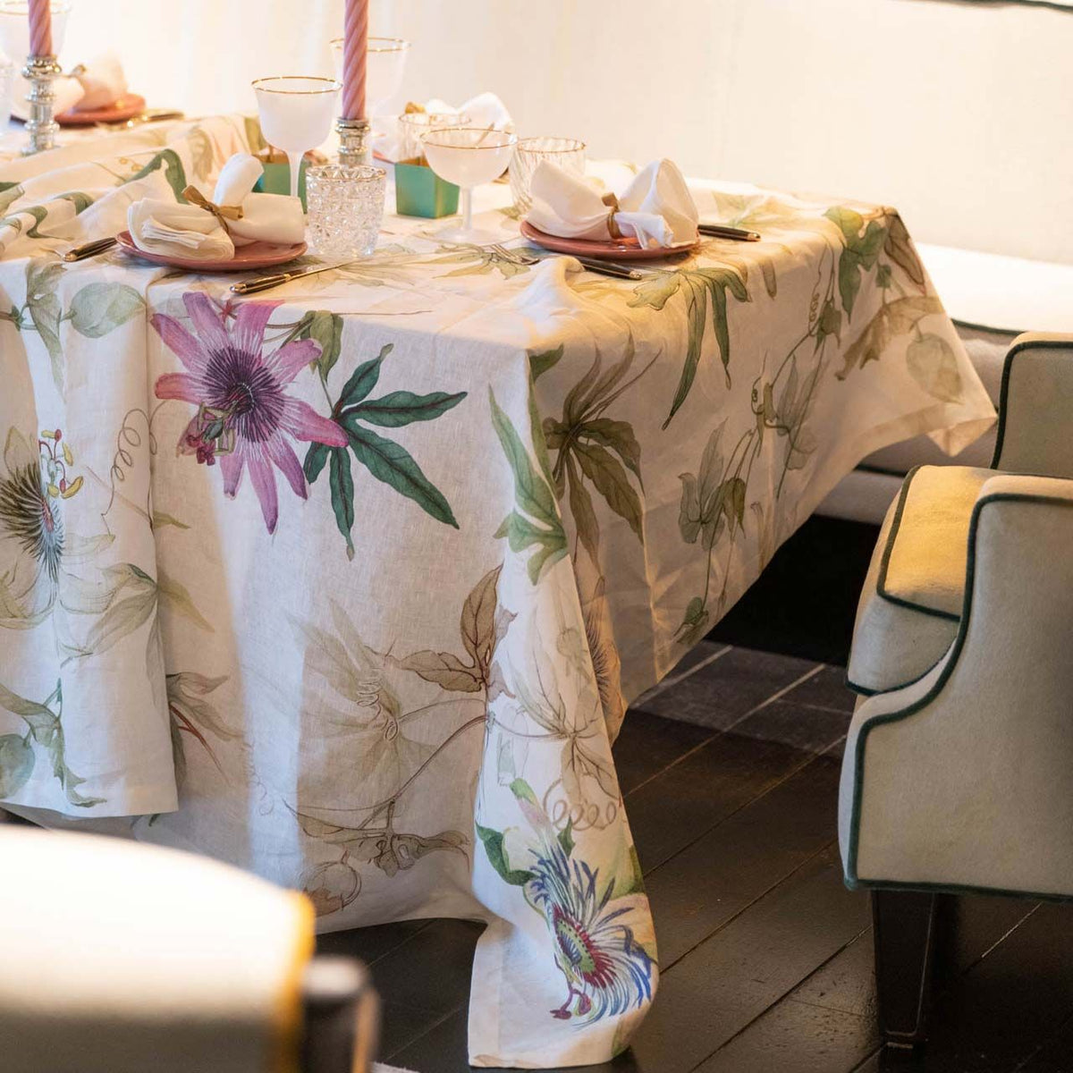 Table set with Passionflower Tablecloth featuring large-scale passionflower watercolors on Italian Linen from Caskata, shown in 67&quot; x 106&quot; size.