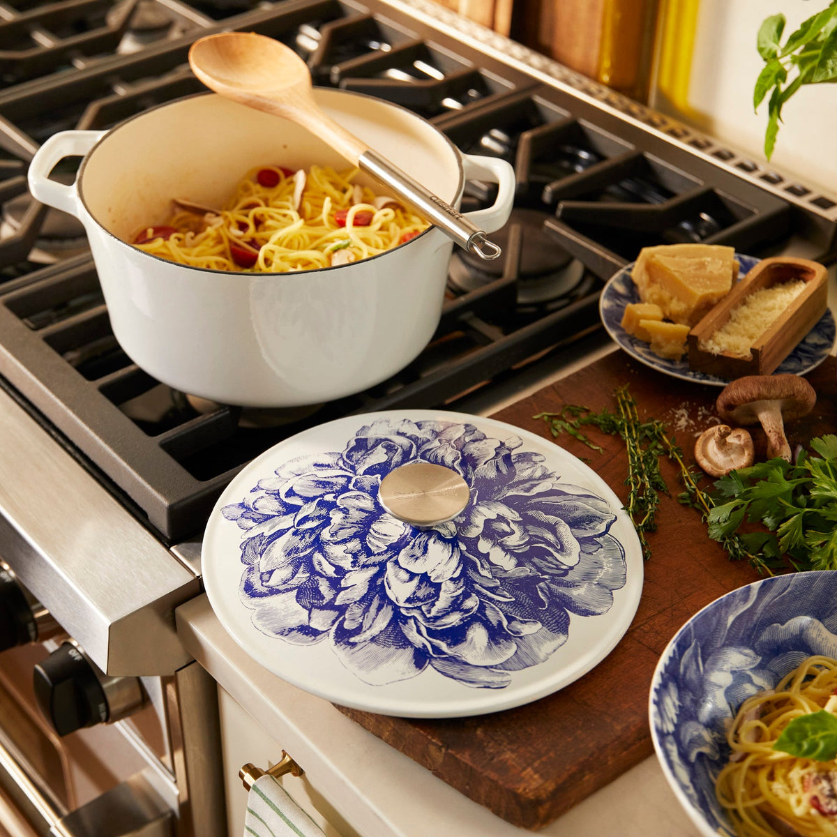 Description: A Cuisinart cast iron pot of pasta on a stove top.