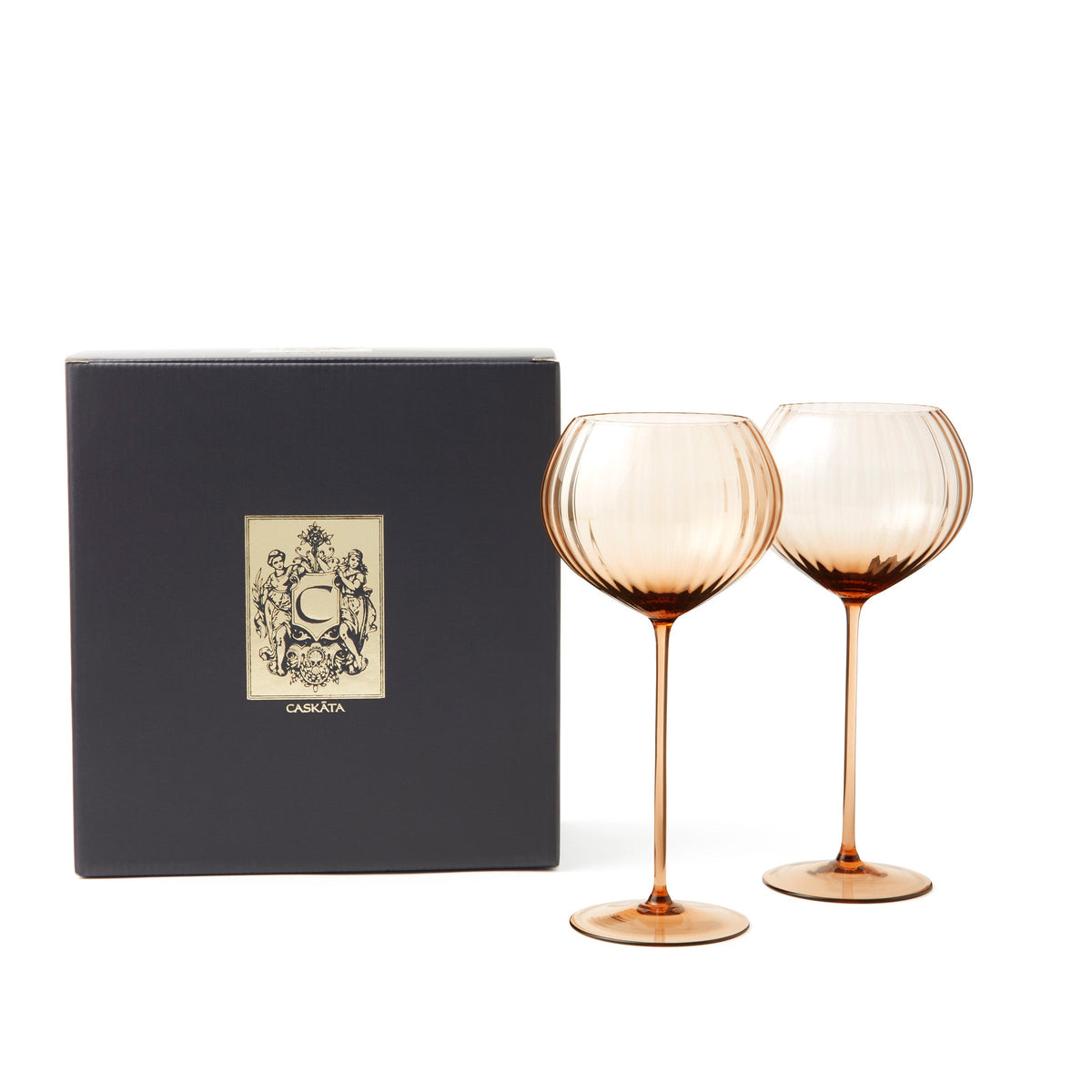 Set of 2 Quinn Amber Red Wine Glasses from Caskata, with a black and gold gift box.