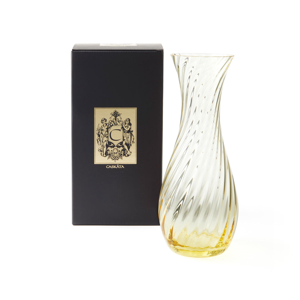Citrine Quinn Carafe by Caskata with a black and gold gift box.