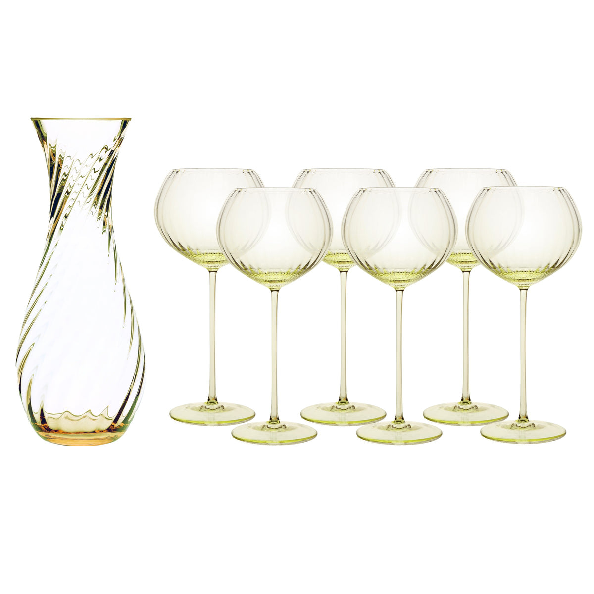 The Quinn Citrine Red Wine Lover Set by Caskata features a clear glass carafe with a swirl pattern and six matching crystal red wine glasses, all with a subtle yellow-green tint and exquisite Czech craftsmanship.