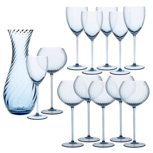 The Quinn Ocean Wine Lovers Set by Caskata features a blue-tinted glass carafe, four goblets, and eight crystal wine glasses with matching swirl patterns and stems, arranged on a white background—the ideal set for wine lovers.