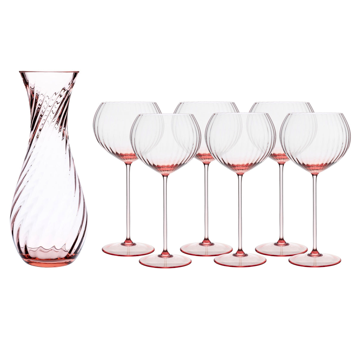 The Quinn Rose Red Wine Lover Set by Caskata includes six handmade wine glasses with pink-tinted stems and bases, plus a matching pink-tinted carafe featuring a swirled pattern—perfect for stylish gatherings.