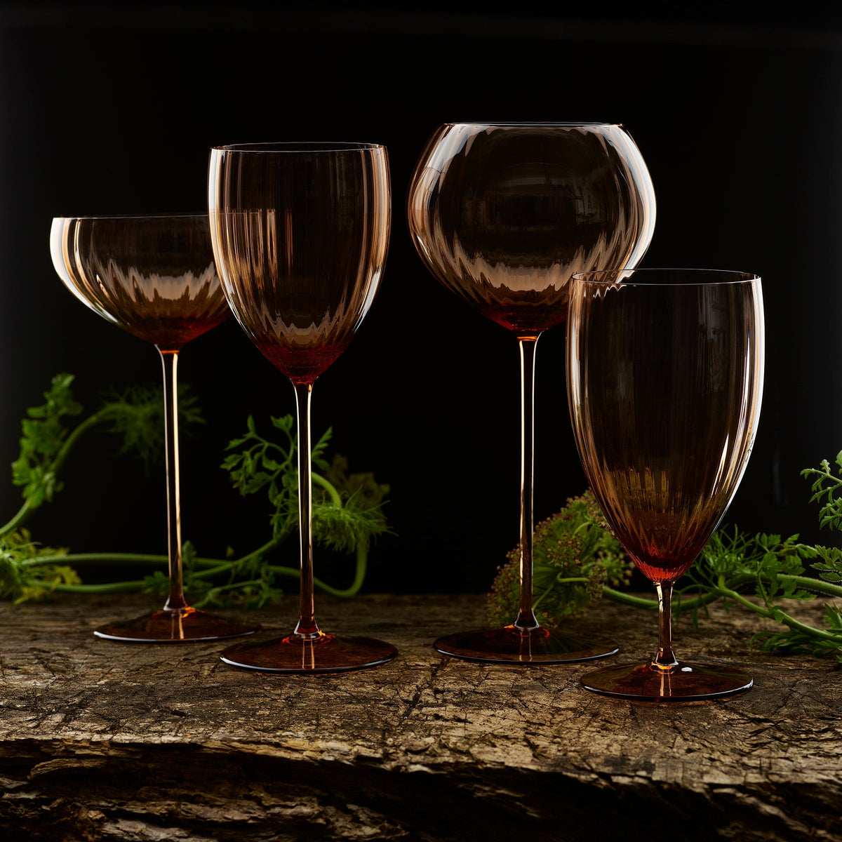 Quinn Amber Red Wine Glasses Set/2 - Caskata, in a dark woodland setting. 
