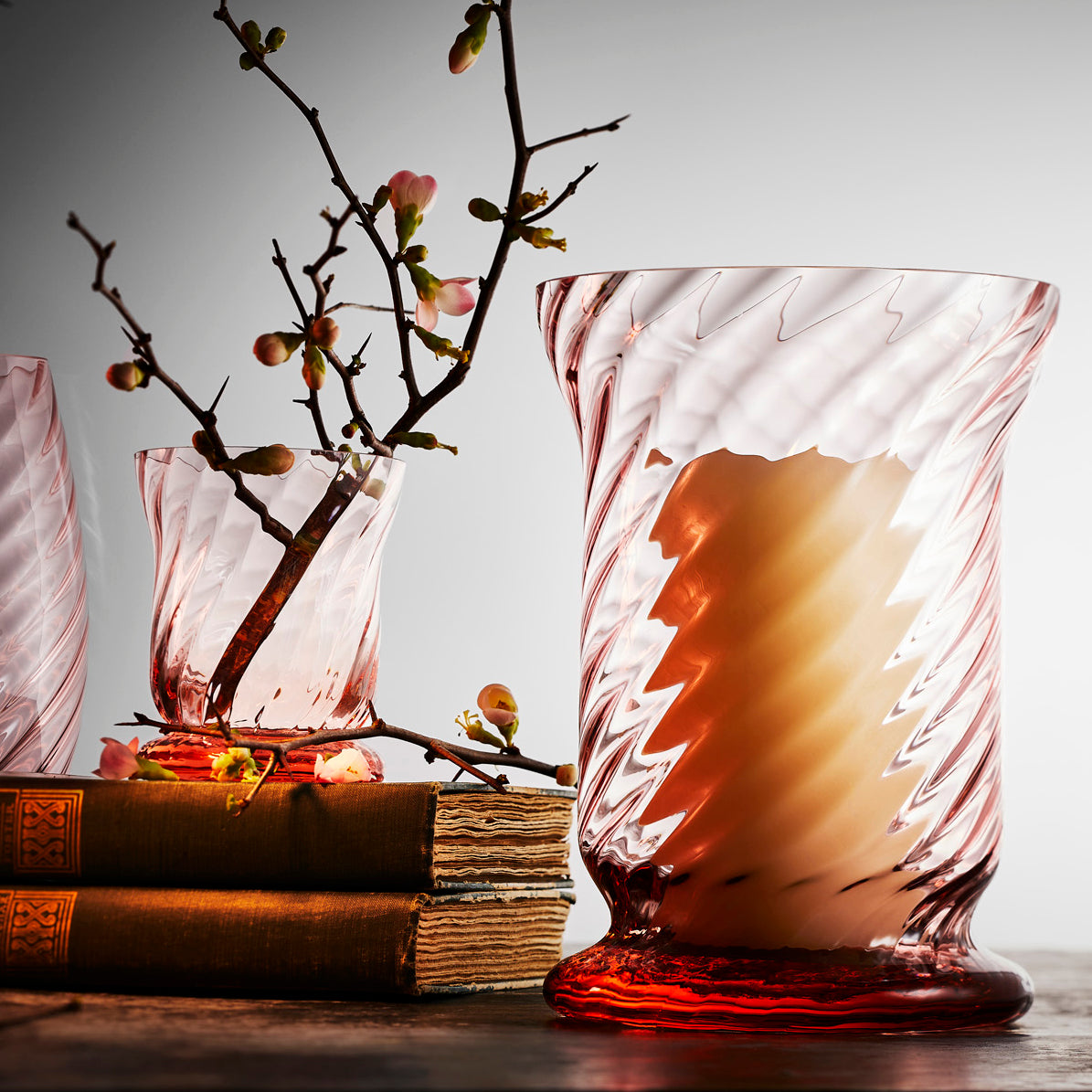Quinn Rose Pink Hurricane and Votive Crystal Boothbay Candle Holders from Caskata in a lifestyle image.