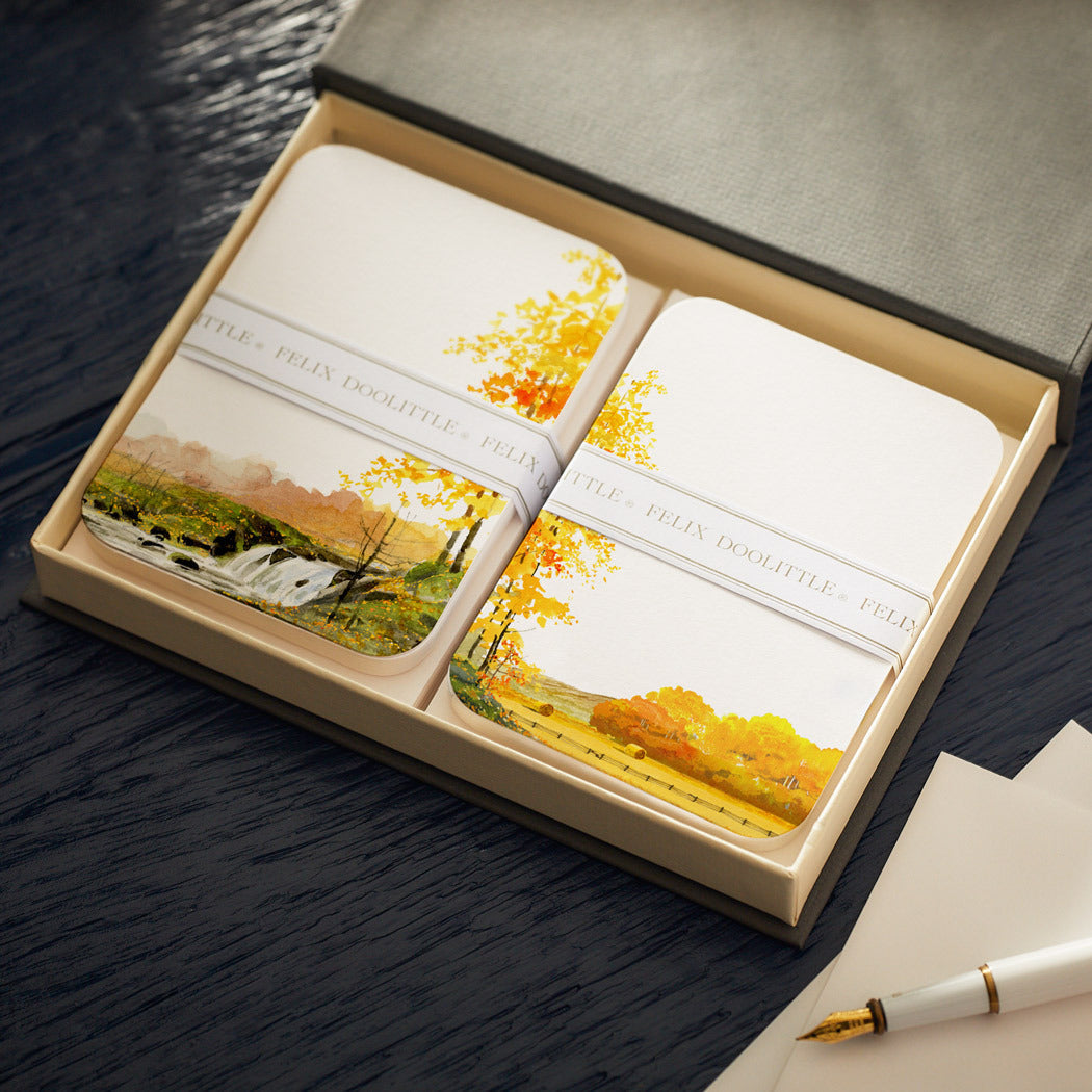A handmade gift set of Caskata X Felix Doolittle Autumn Note Card Set and a pen in a box, by Felix Doolittle.