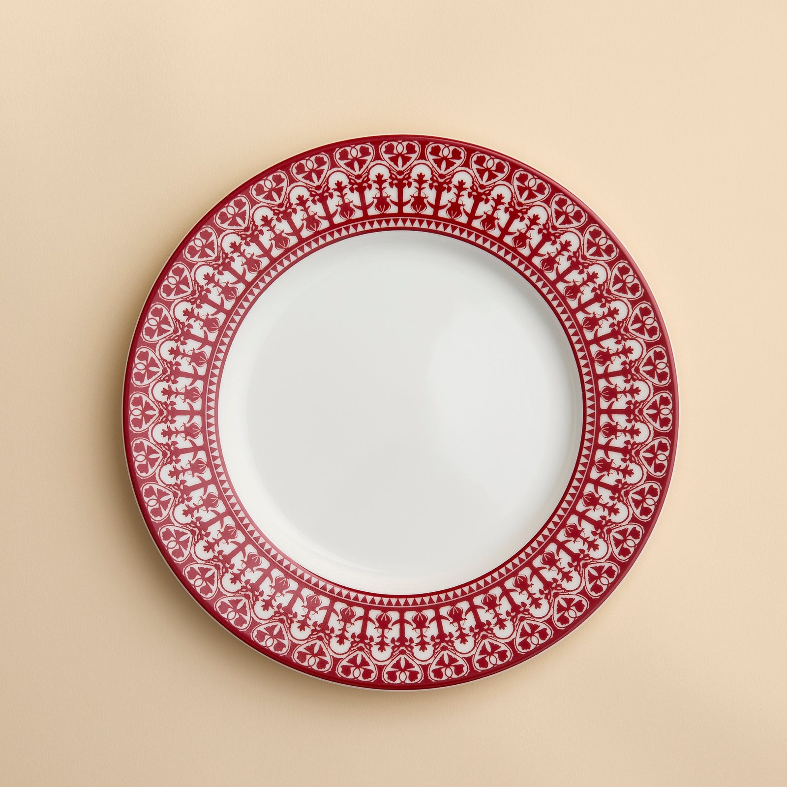 Casablanca pattern in Crimson Red from Caskata on this porcelain rimmed salad plate against a creamy beige background