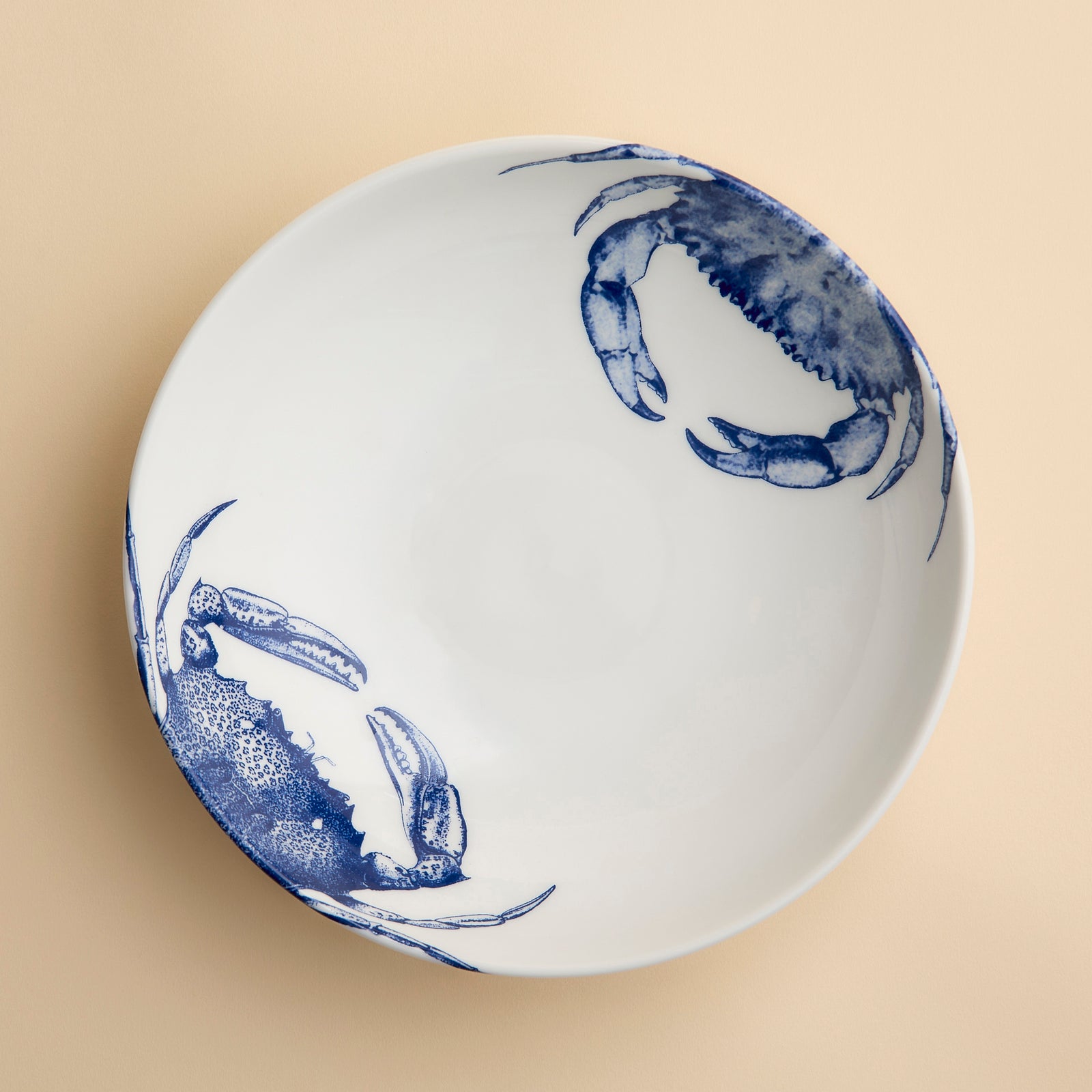 Crab Entree bowl from Caskata featuring detailed engravings of two different crabs in brilliant blue glaze on a high-fired porcelain bowl perfect for soup, stews, salads or dinner.