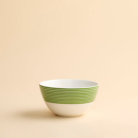 Newport Verde Cereal Bowl in porcelain with bright green concentric lines around the top half of this perfectly sized bowl from Caskata.