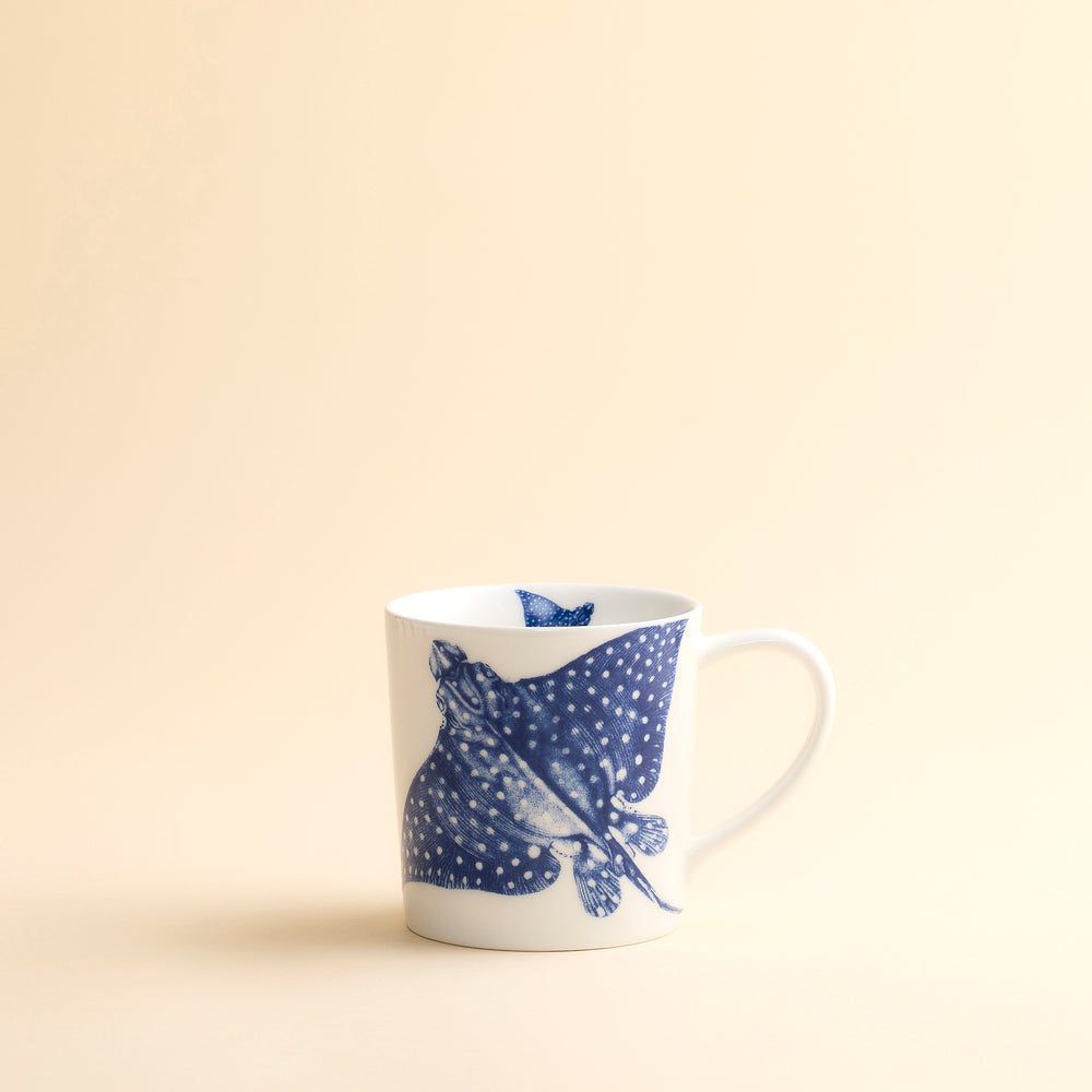 Ray the Stingray floats around the inside and outside of this oversized, dishwasher-safe mug in high-fired porcelain from Caskata.