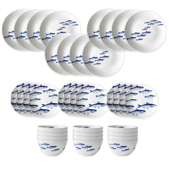 The Caskata School of Fish Table for 12 is a 36-piece porcelain dinnerware set with plates, bowls, and cups, each featuring blue fish patterns. Both dishwasher and microwave safe, it's a stylish and durable choice for everyday use.