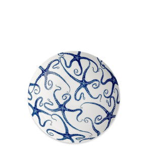 The Caskata Starfish Entrée Bowl features an intricate blue starfish pattern on a round white design, perfect for bringing coastal style to your table.