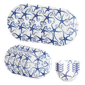 The Caskata Starfish Table for 4 set includes six white plates and six bowls with blue octopus tentacle patterns—perfect coastal dishes to bring a touch of the ocean to your table.