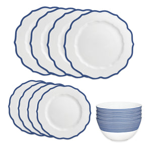 The Caskata Stella Blue Table for 4 set includes six large plates, six small plates, and one bowl, all in white with blue rim designs. Dishwasher and microwave safe, this porcelain set brings elegance to any table.