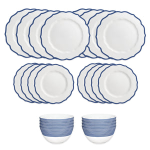 The Caskata Stella Blue Table for 8 is a 16-piece, high-fired porcelain dinnerware set with scalloped white plates featuring blue trim and two bowls with blue stripes; dishwasher and microwave safe.