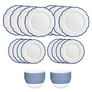 The Caskata Stella Blue Table for 8 is a 16-piece, high-fired porcelain dinnerware set with scalloped white plates featuring blue trim and two bowls with blue stripes; dishwasher and microwave safe.