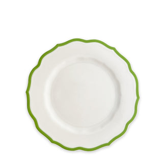 A Caskata Stella Scalloped Verde Salad Plate with a white ceramic body and a scalloped green rim evokes an heirloom feel, set against a plain white background.
