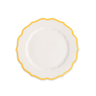 The Caskata Stella Scalloped Marigold Salad Plate is an elegant white porcelain plate with a scalloped edge and yellow border, shown on a plain white background.