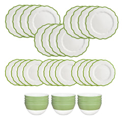 The Caskata Stella Verde Table for 12 is a 36-piece dinnerware set with 24 white porcelain plates featuring green rims and 12 matching bowls, all elegantly arranged for a stylish dining presentation.