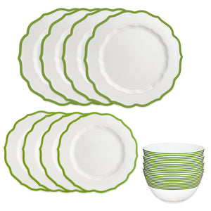 Caskata's Stella Verde Table for 4 is a white porcelain dinnerware set with scalloped green-edged dishes—four large plates, four small plates, and four bowls—displayed on white. Dishwasher and microwave safe.