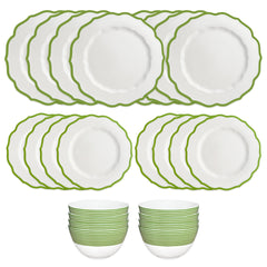 The Caskata Stella Verde Table for 8 is a 24-piece dinnerware set with twelve white porcelain dishes featuring green edges and twelve matching bowls, stacked in two groups on a white background—ideal tableware for eight.
