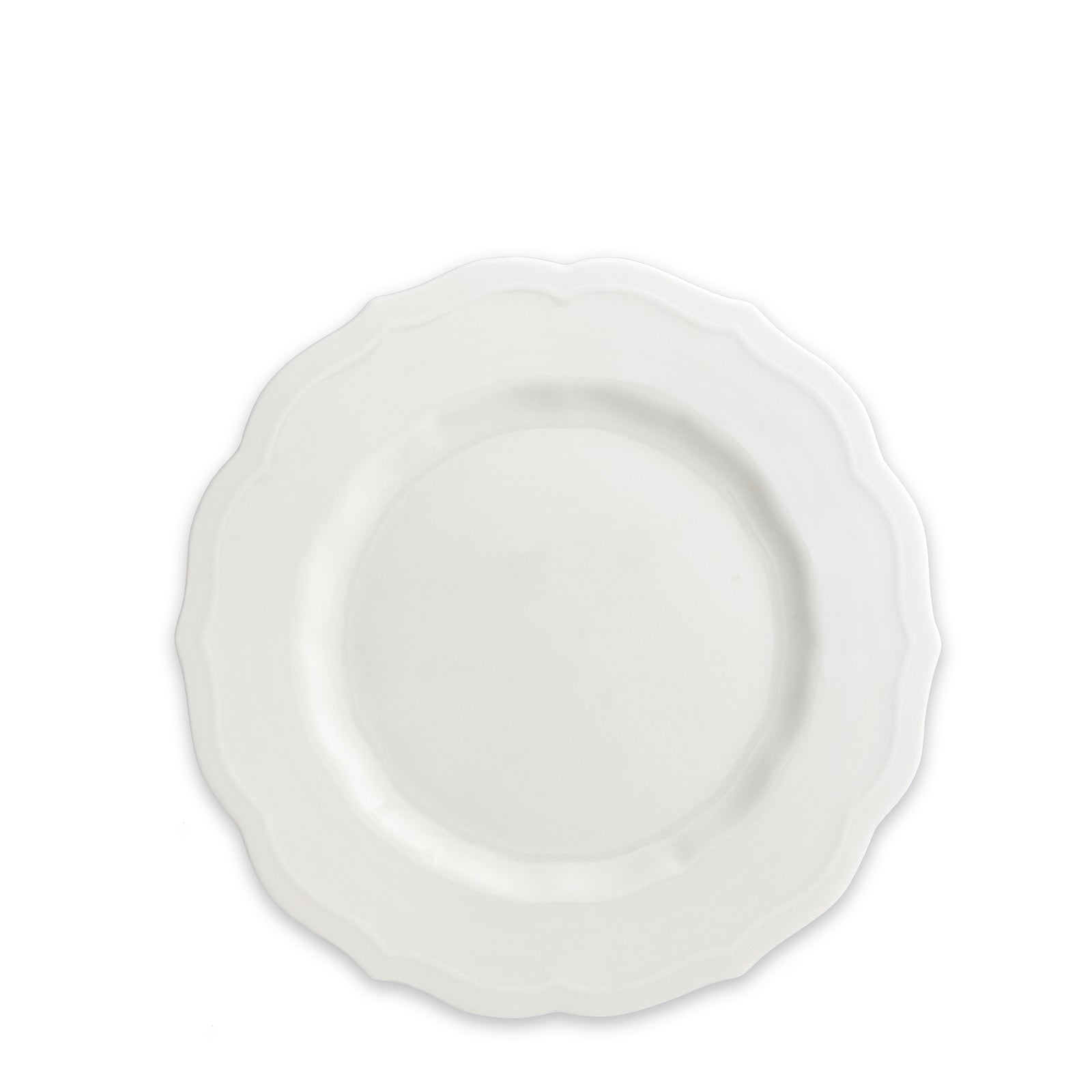 The Stella Scalloped White Salad Plate by Caskata features a scalloped edge that exudes an heirloom feel and is crafted from high-fired porcelain for lasting elegance.