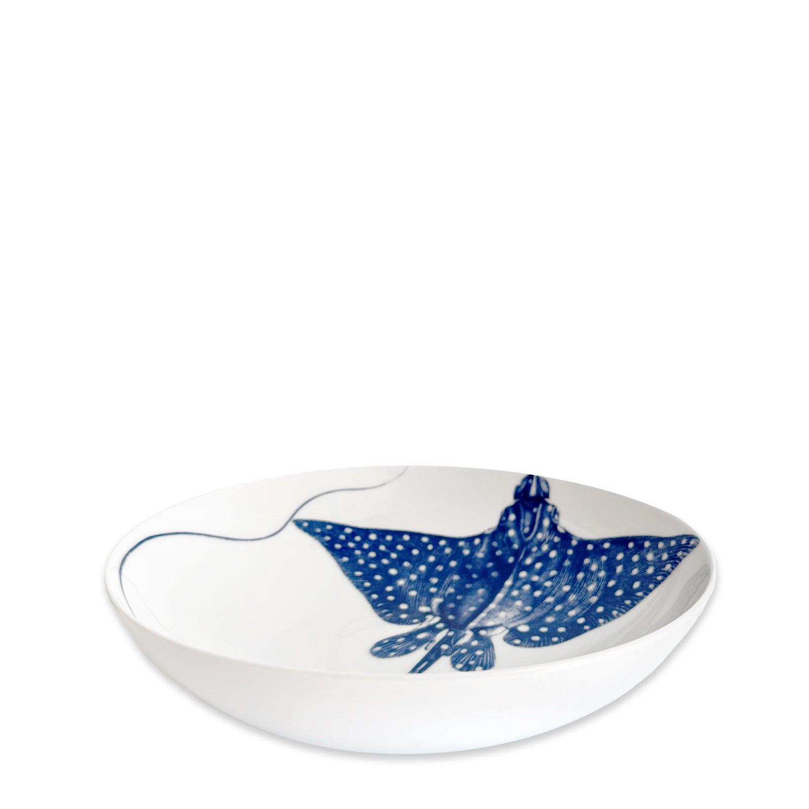 Caskata's "Ray" the Stingray Entrée Bowl features a white ceramic design with a blue spotted stingray illustration inside—an ideal coastal accent for your table.