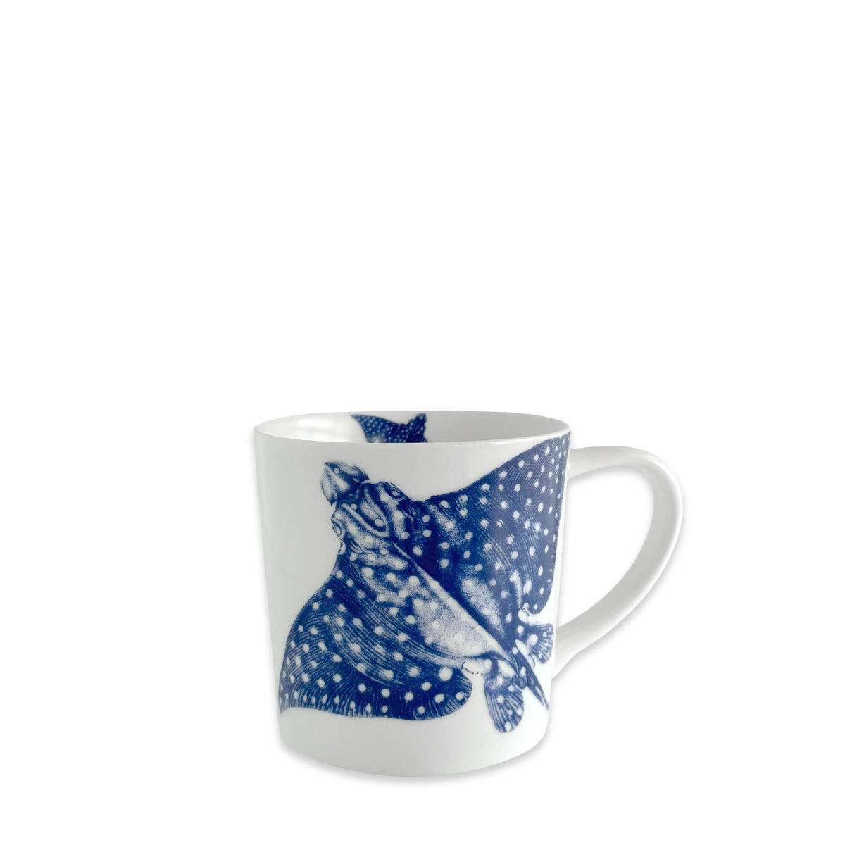 The Caskata "Ray the Stingray Mug" is a white porcelain mug showcasing a blue spotted stingray illustration—ideal for adding charming coastal vibes to your drinkware collection.