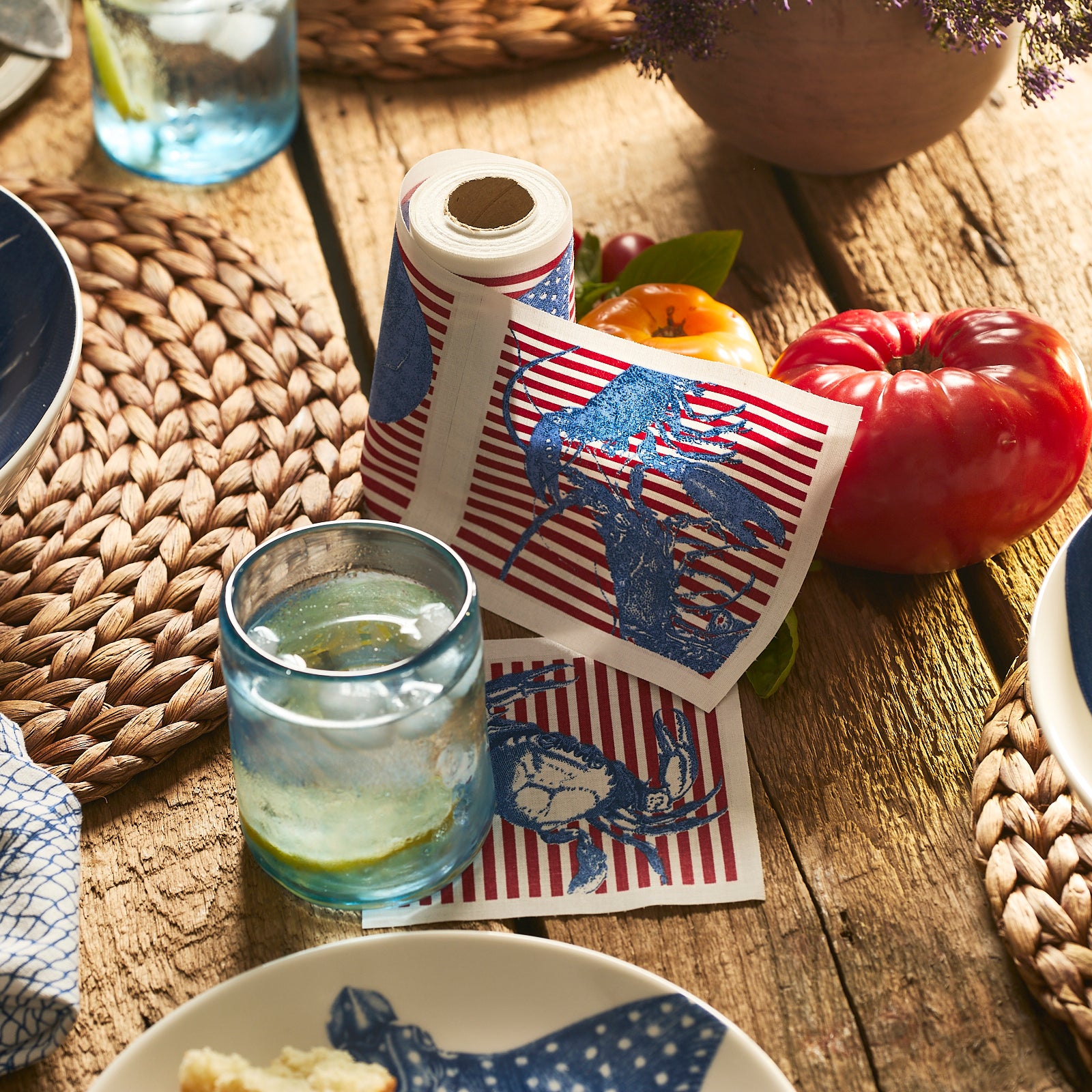 Caskata Seaside Stripe Cocktail Napkin Roll with Red Stripes and Blue Crabs and Lobsters. Made of cotton, reusable & washable, four different designs shown on a white background.