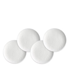 Four Caskata Summer White Small Plates, crafted from high-fired porcelain with a subtle textured floral design, are arranged in a slightly overlapping layout on a white background.