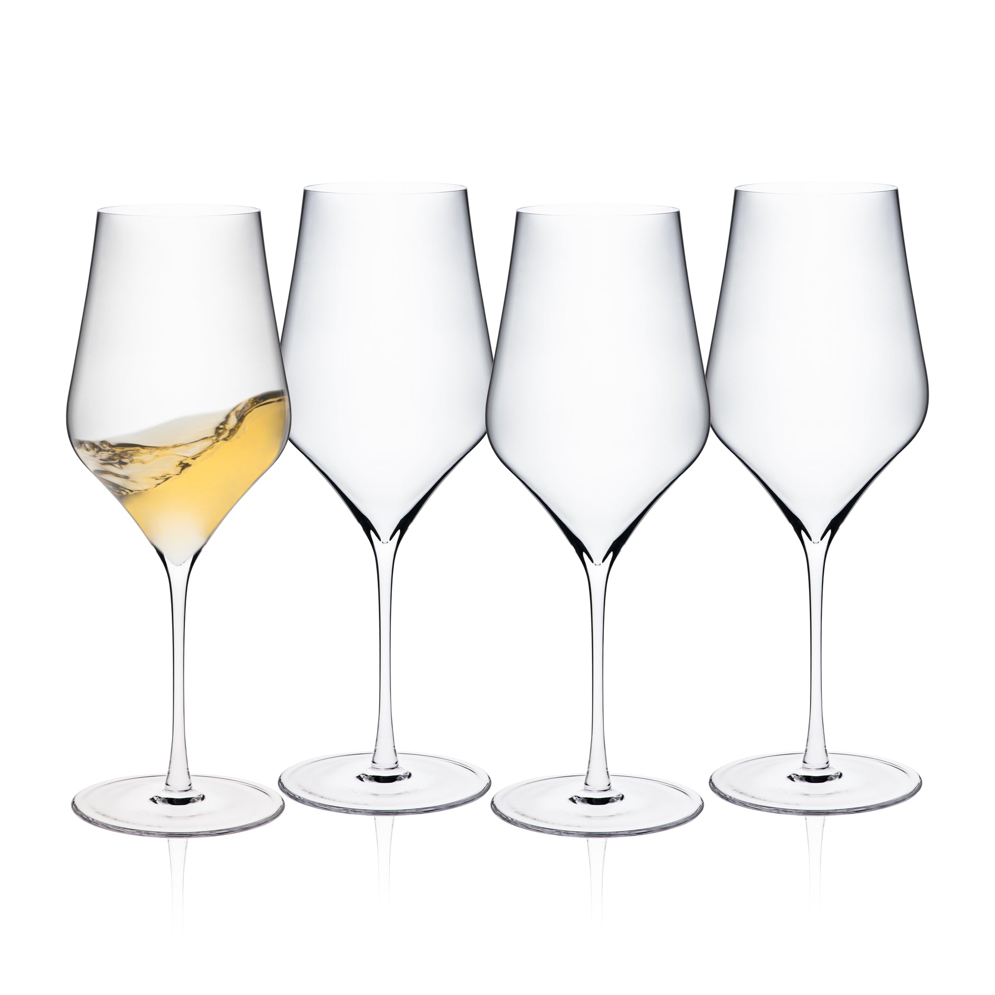 Four empty Terrace White Wine Glasses by Caskata are lined up on a white background, with the leftmost glass containing a small amount of white wine.