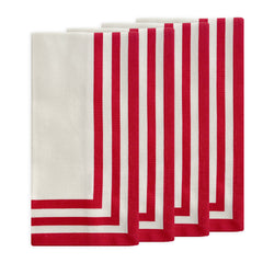 Set of four Caskata Triple Stripe Red Dinner Napkins, made from machine-washable cotton and featuring three red stripes, add a classic touch to your table.