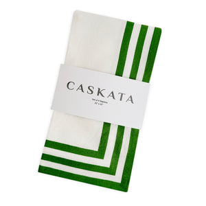 A folded white cotton napkin with green striped borders, packaged in a white paper band labeled 