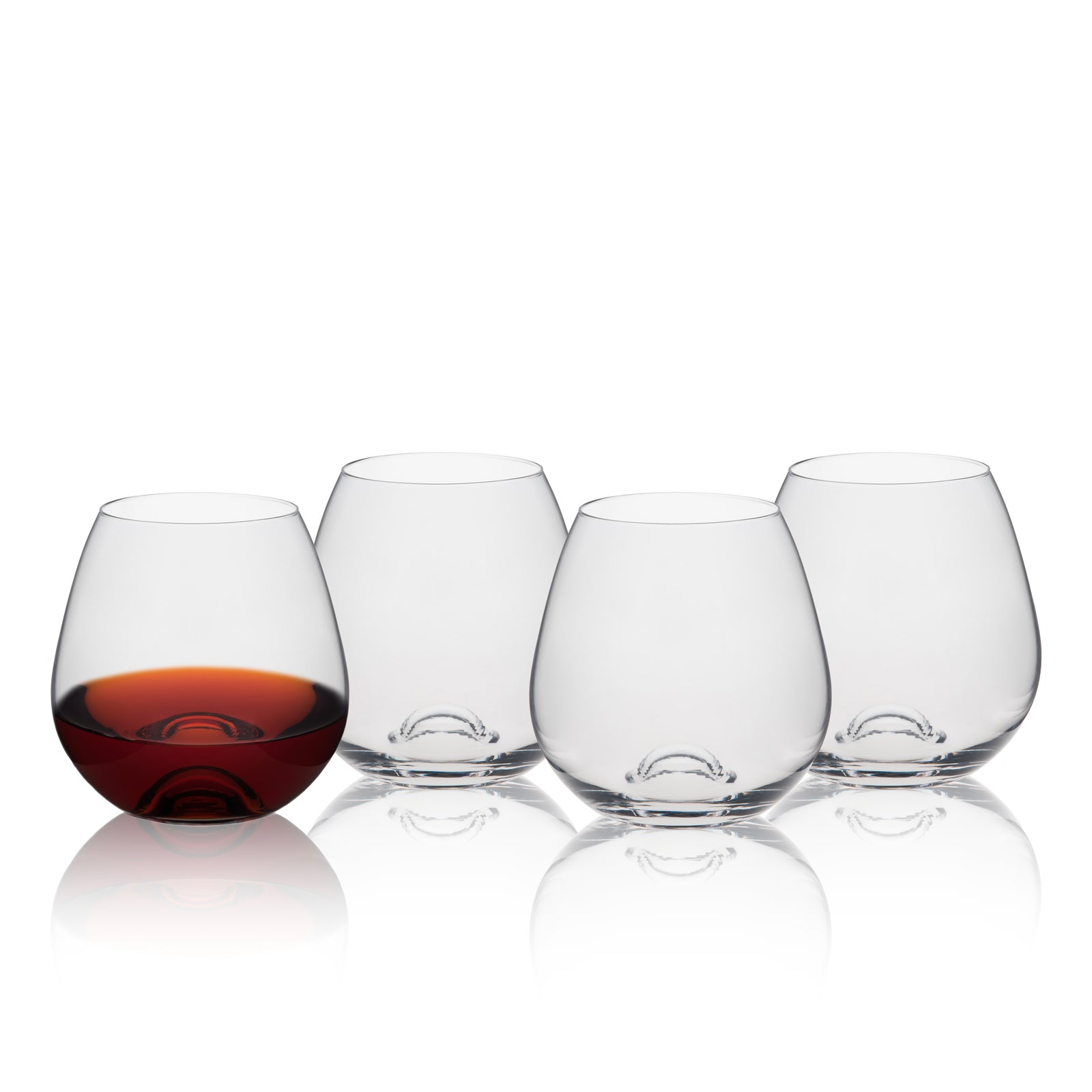 Four Tuesday Stemless Wine Glasses by Caskata are shown in a row; the left glass holds a dark liquid while the other three are empty. This set of four lead-free crystal tumblers suits any occasion.