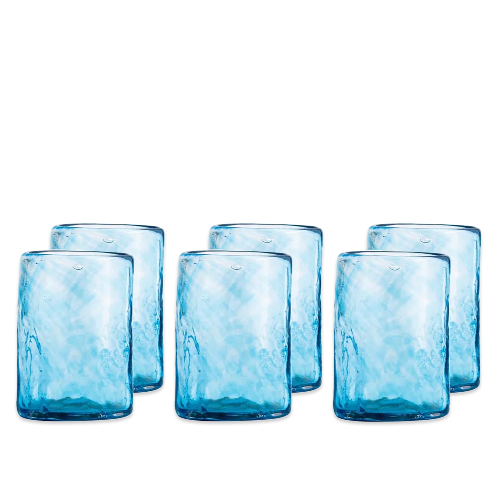 Six Viento Medium Blue Tumblers from Caskata are arranged in two rows against a white background, highlighting the unique handblown artistry and recycled glass craftsmanship of this set of six.