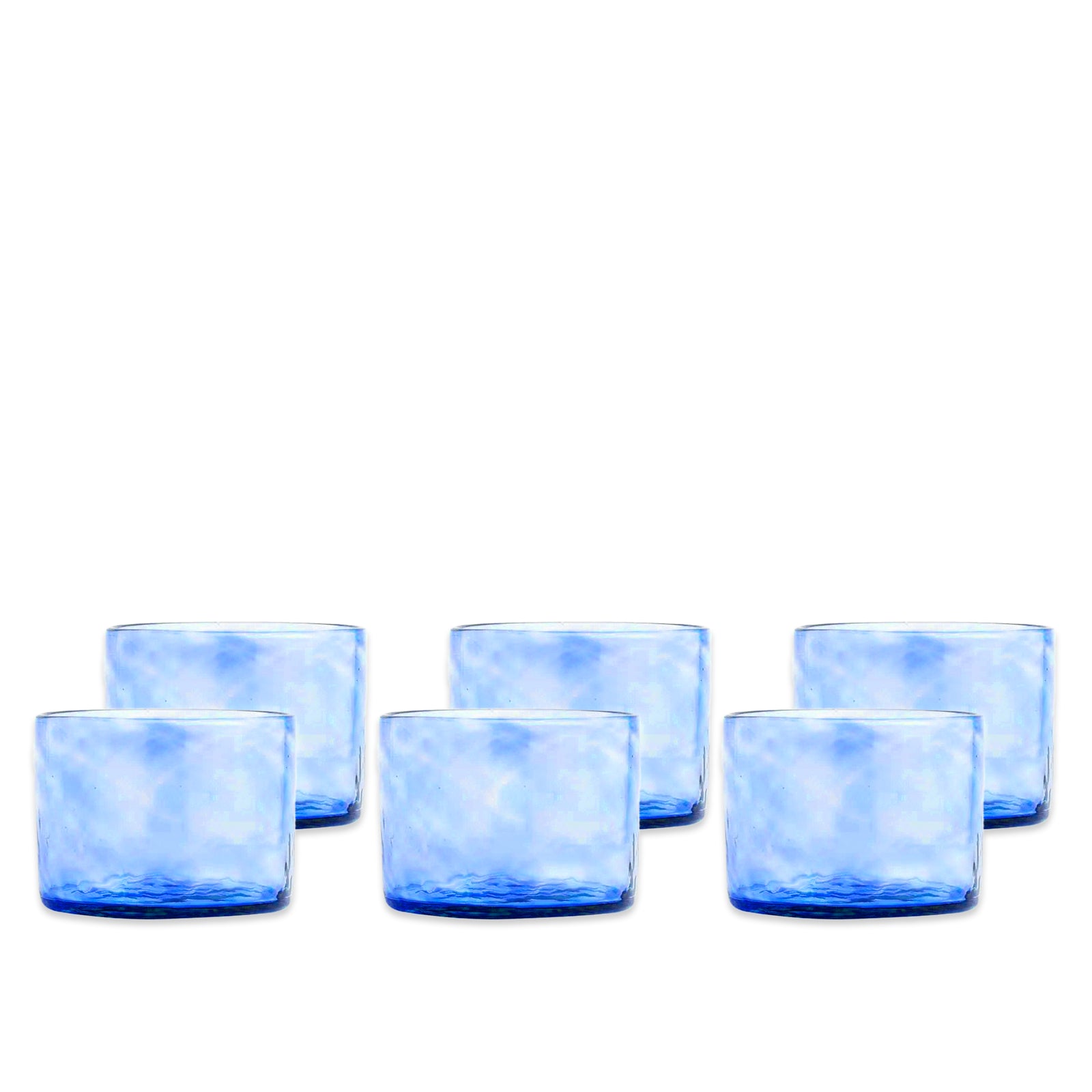 Set of 6 Viento Small Cobalt Tumblers by Caskata, featuring short, cylindrical blue glass design, displayed in two rows on a white background.