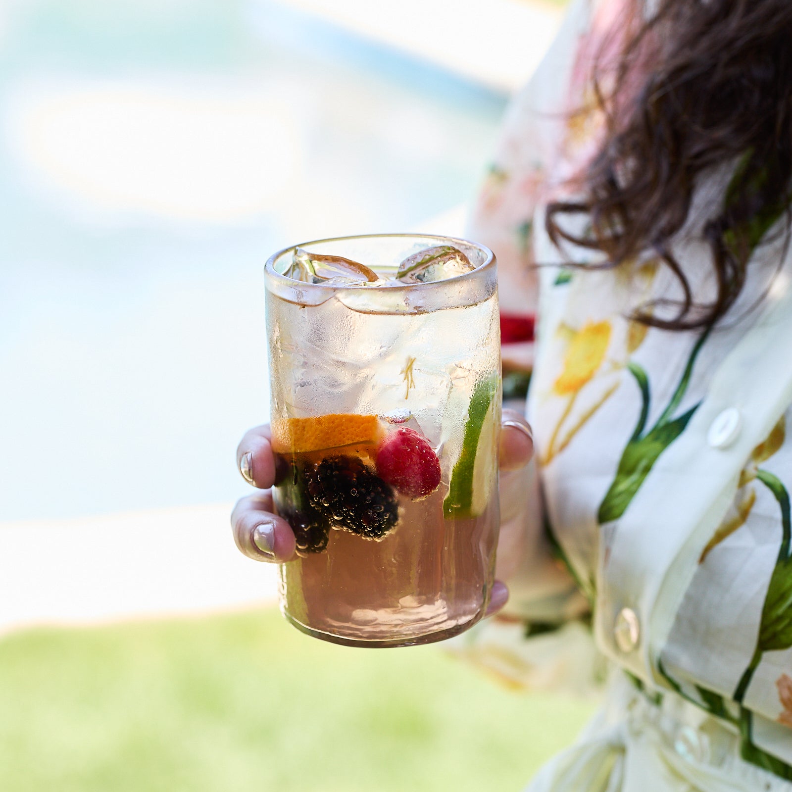 Set of six Viento Large Clear Tumblers by Caskata, featuring a slight texture and handblown design, are arranged in two rows against a white background.