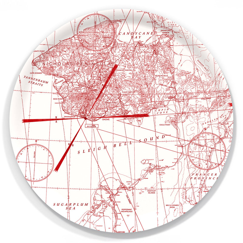 The Caskata White Holiday Hunt Large Round Tray is a decorative birchwood tray made in Finland, showcasing a red map-style North Pole illustration with whimsical spots like Candy Cane, Sleigh Bell Sound, and Sugarplum Sea.